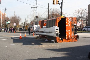 A large Parks Department truck was knocked over in the middle of Grand Ave. on the corner of 72nd St.